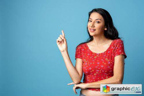 Cheerful Asian woman isolated on blue background