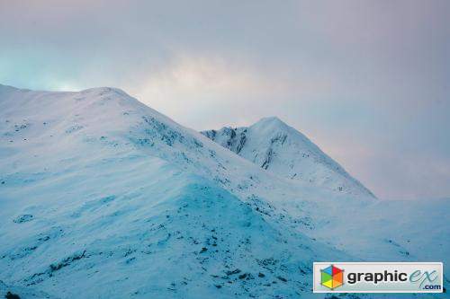 Snowy mountain top on a cloudy day